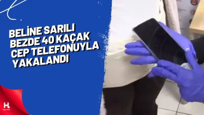 Beline sarılı bezde 40 kaçak cep telefonuyla yakalandı