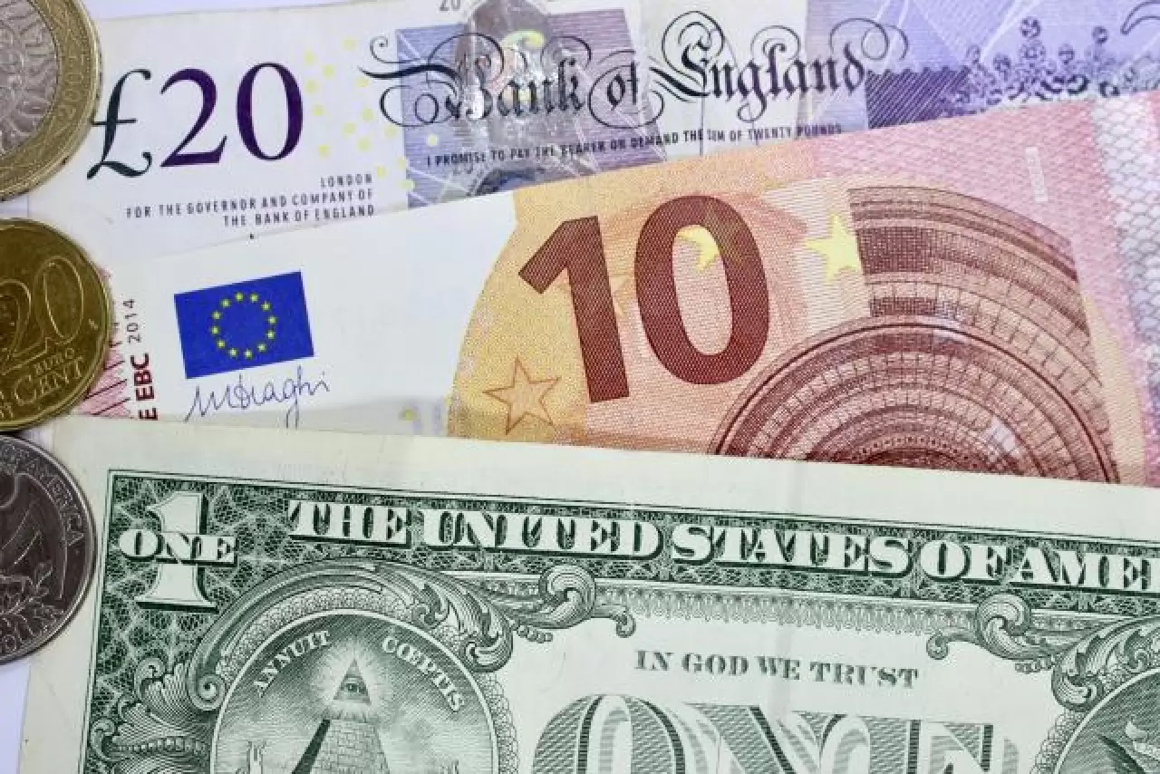 Pound and euro fall against dollar as economic data warns of recession